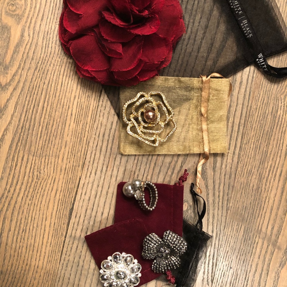 3 White House black market rings and 2 brooches.